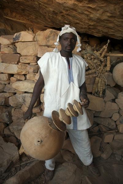 Dogon with ceremonial musical instrument